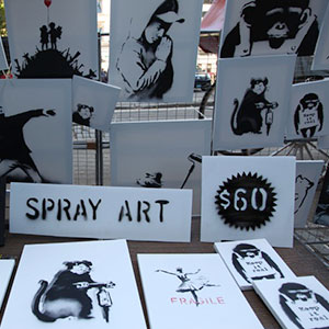 Banksy's Unpublicized Art Stand Sells Signed, Original Canvases for $60