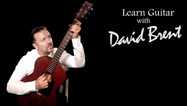 Watch Ricky Gervais Give His First Guitar Lesson as The Office's David