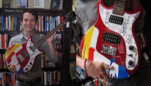 Apples in Stereo and Elijah Wood auction off guitar