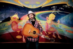 Steve Earle is on the road again