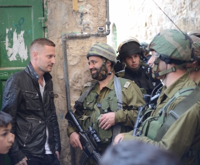Breaking Borders_Series Premiere_Michael Voltaggio talks with Israeli security in Hebron (400x329) (2).jpg