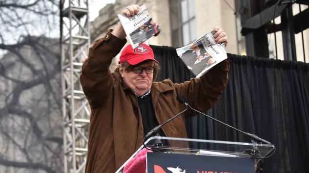 Michael Moore Rips Up a Copy of <i>Washington Post</i> at Women's March