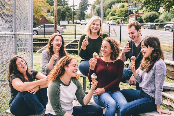 women laughing together with ice cream.jpg